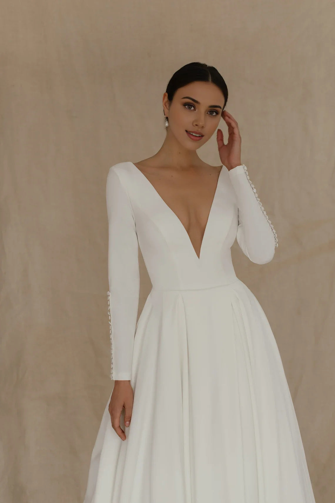 White Satin A‑Line Deep‑V Button‑Cuff Long‑Sleeve Open‑Back Chapel‑Train Wedding Dress For Church