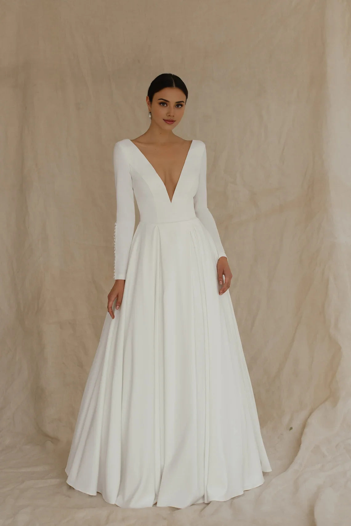 White Satin A‑Line Deep‑V Button‑Cuff Long‑Sleeve Open‑Back Chapel‑Train Wedding Dress For Church