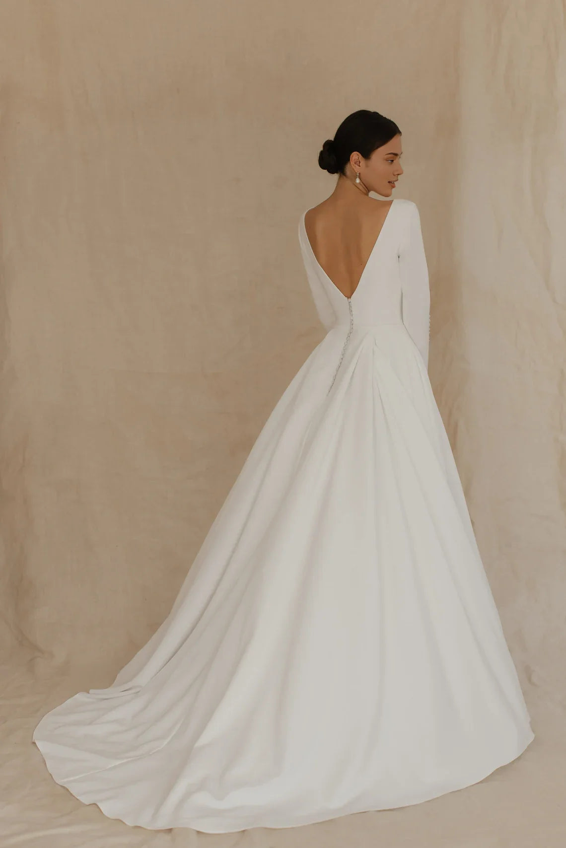 White Satin A‑Line Deep‑V Button‑Cuff Long‑Sleeve Open‑Back Chapel‑Train Wedding Dress For Church