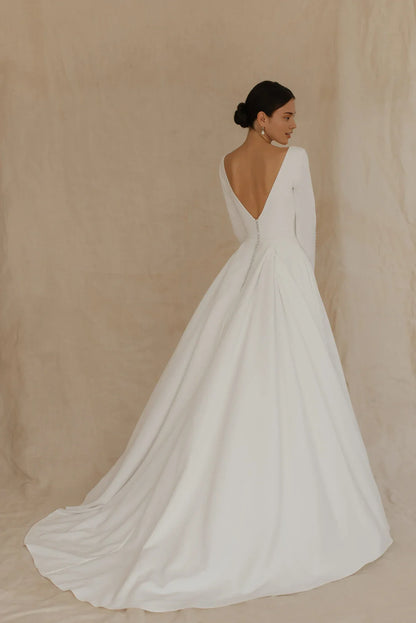 White Satin A‑Line Deep‑V Button‑Cuff Long‑Sleeve Open‑Back Chapel‑Train Wedding Dress For Church